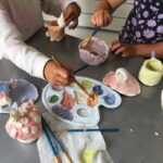 Children glazing ceramics